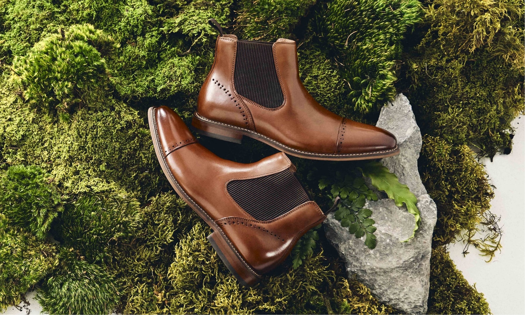 Click to shop Stacy Adams dress shoes. Image features the Maury boot in cognac.