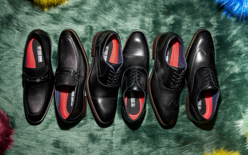Shop Stacy Adams best sellers featuring a spread of black dress shoes on green furry carpet.