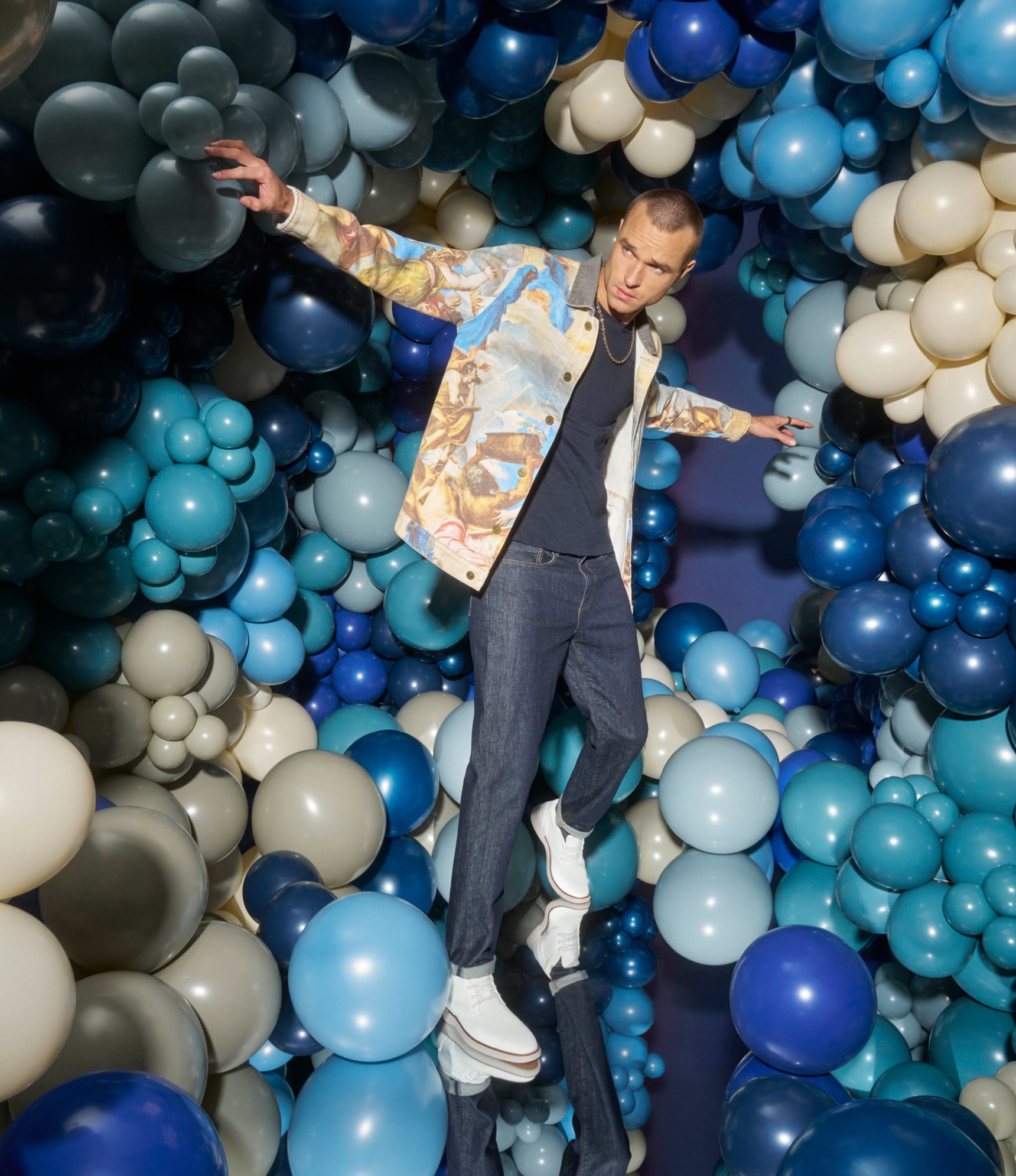 Learn more about our 150 year legacy featuring a man in front of a blue balloon wall.