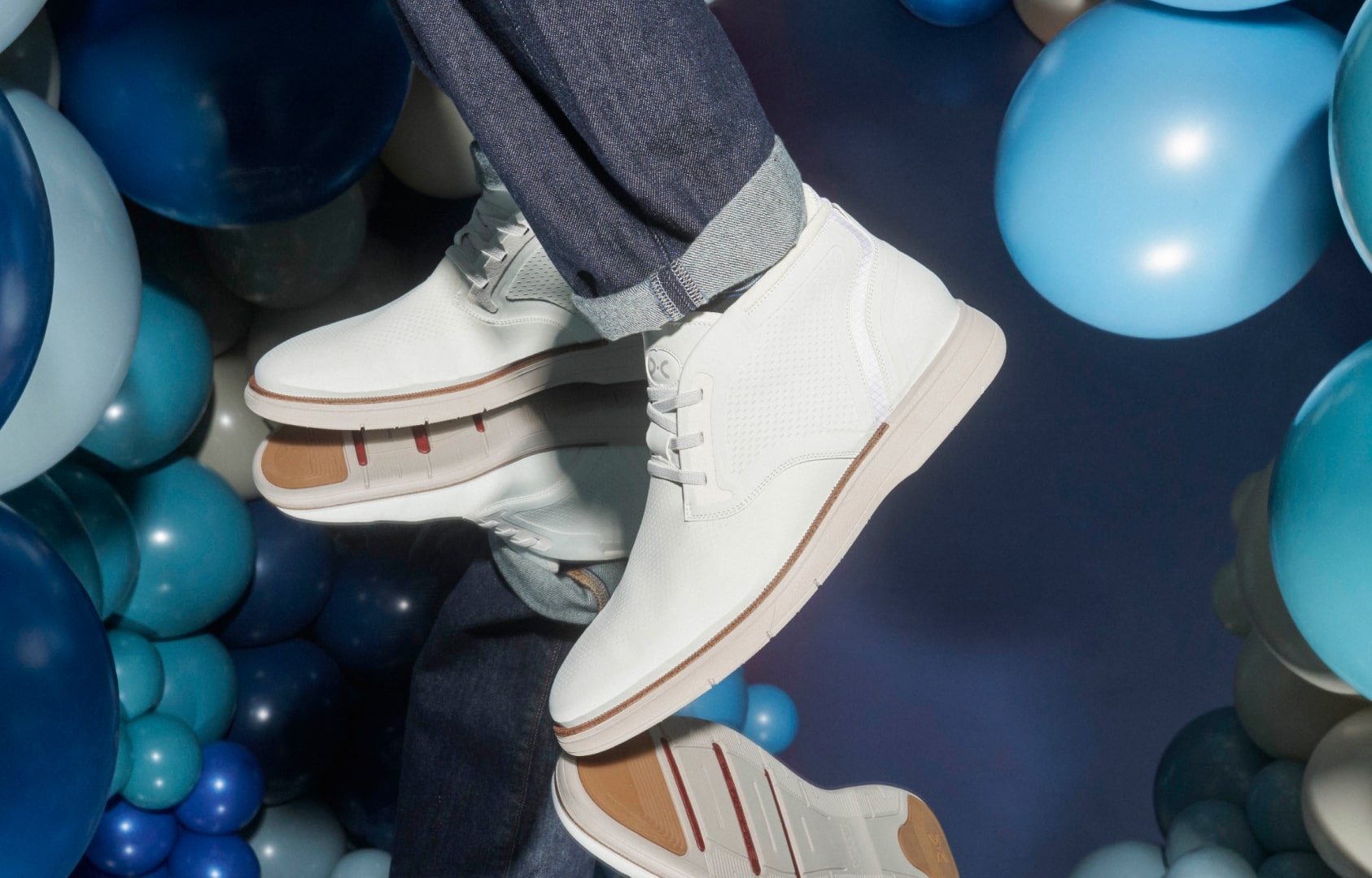 Shop Stacy Adams casuals featuring the Eastmont chukka in white with a blue balloon background.