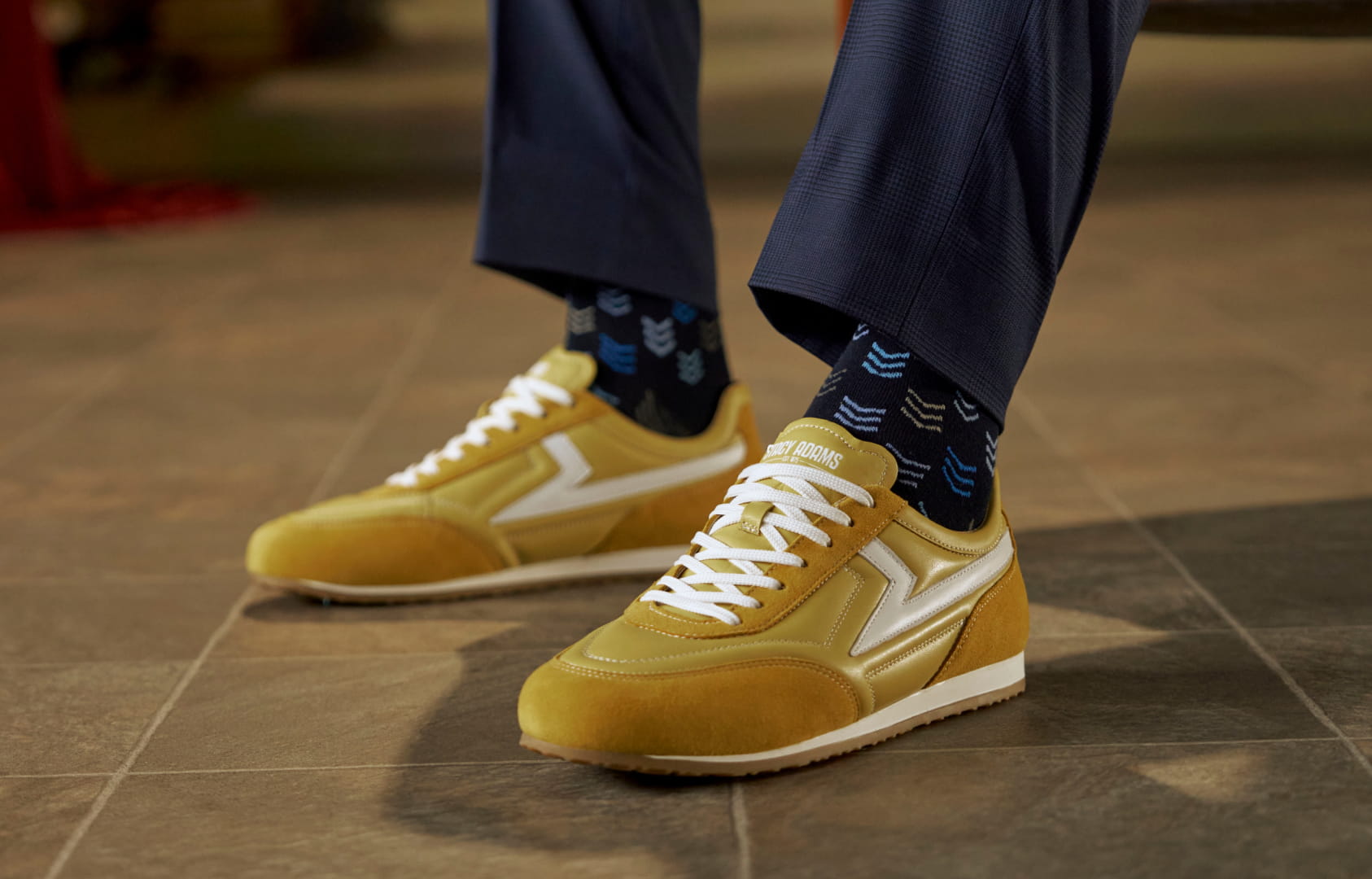 Shop Stacy Adams casuals featuring the Action 150 in yellow on a tile floor.