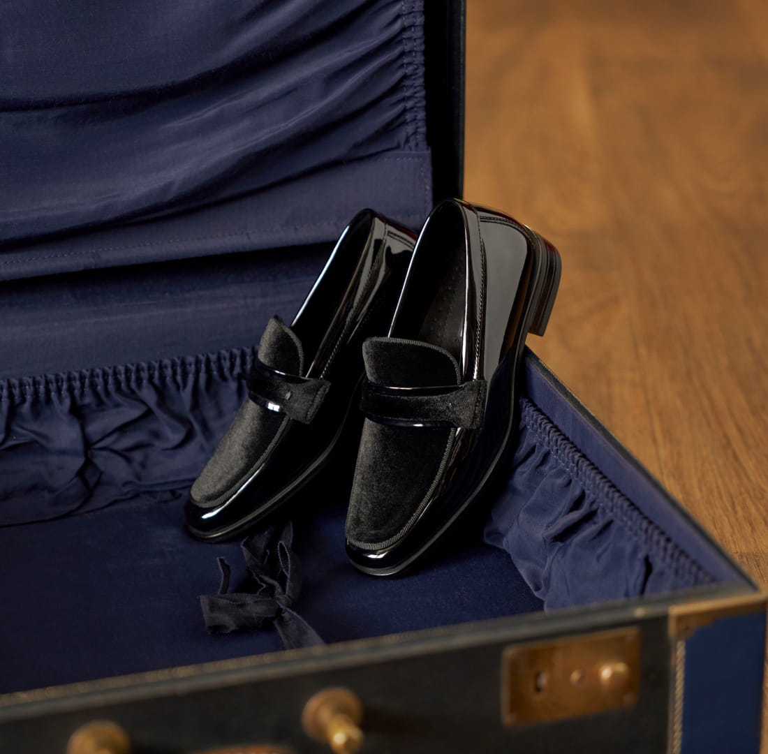 Shop Stacy Adams kids featuring the Kids Spratley Moc Toe Saddle Slip On inside a vintage suitcase.