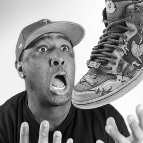 A black and white portrait image of customizer artist Sean Fontenot
