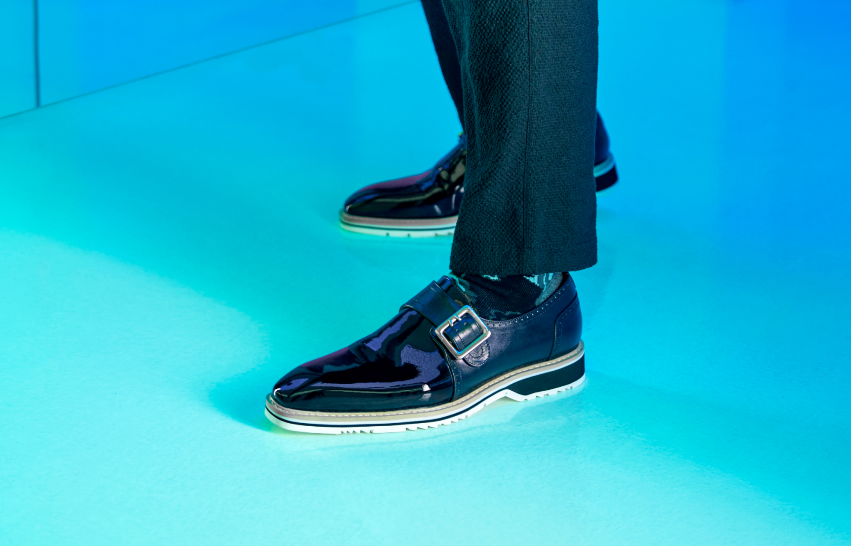 Image features the Bartram monk in black patent on a blue background.