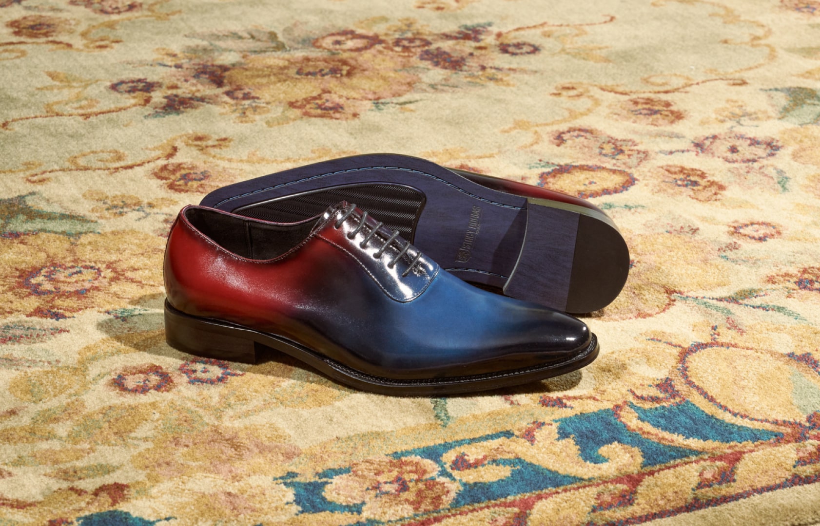 Shop Stacy Adams dress. Image features the Shaffer oxford in navy on a gold floral rug.