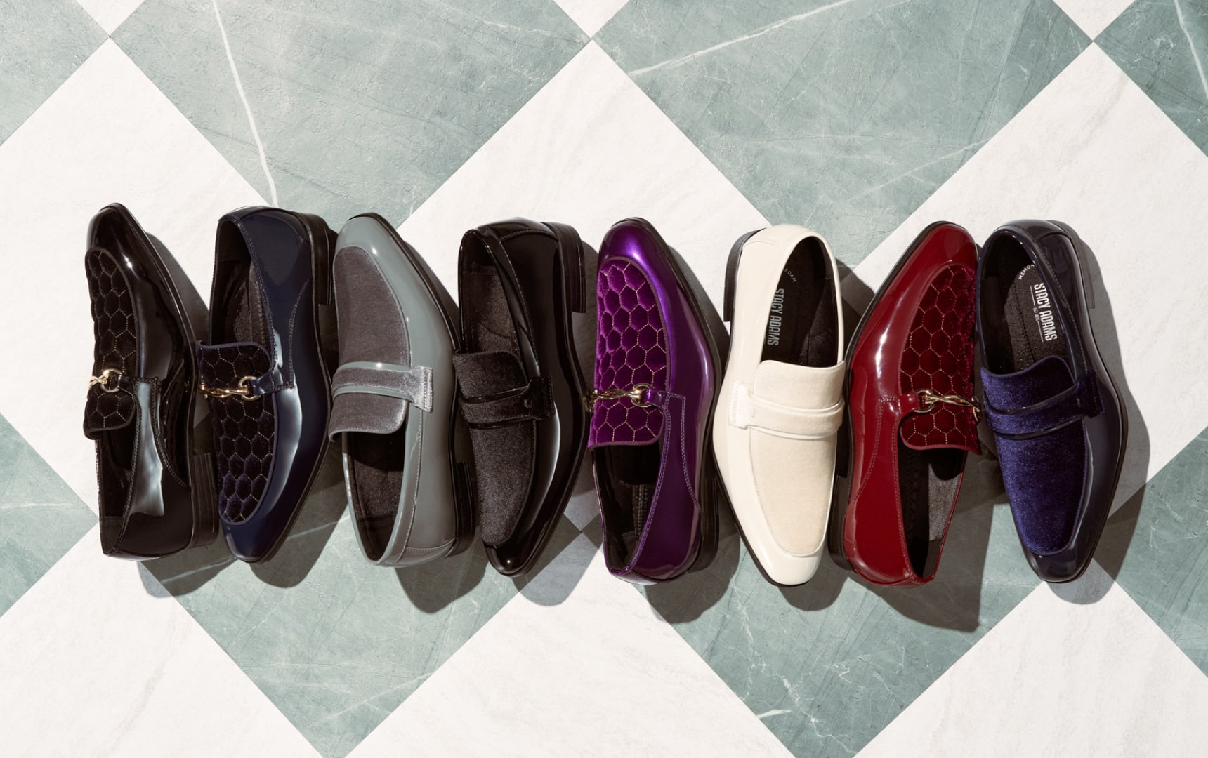 Shop Stacy Adams fashion styles. Image features a spread of fashion shoes on a blue and white checkered floor.