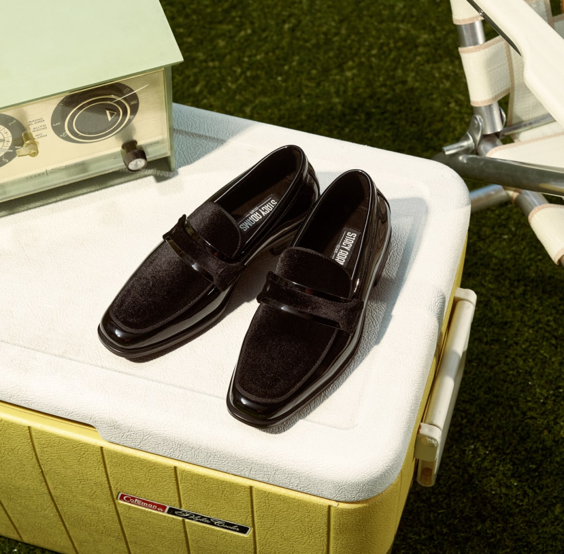 Shop Stacy kids. Image features the Kids Spratley on a vintage yellow cooler.