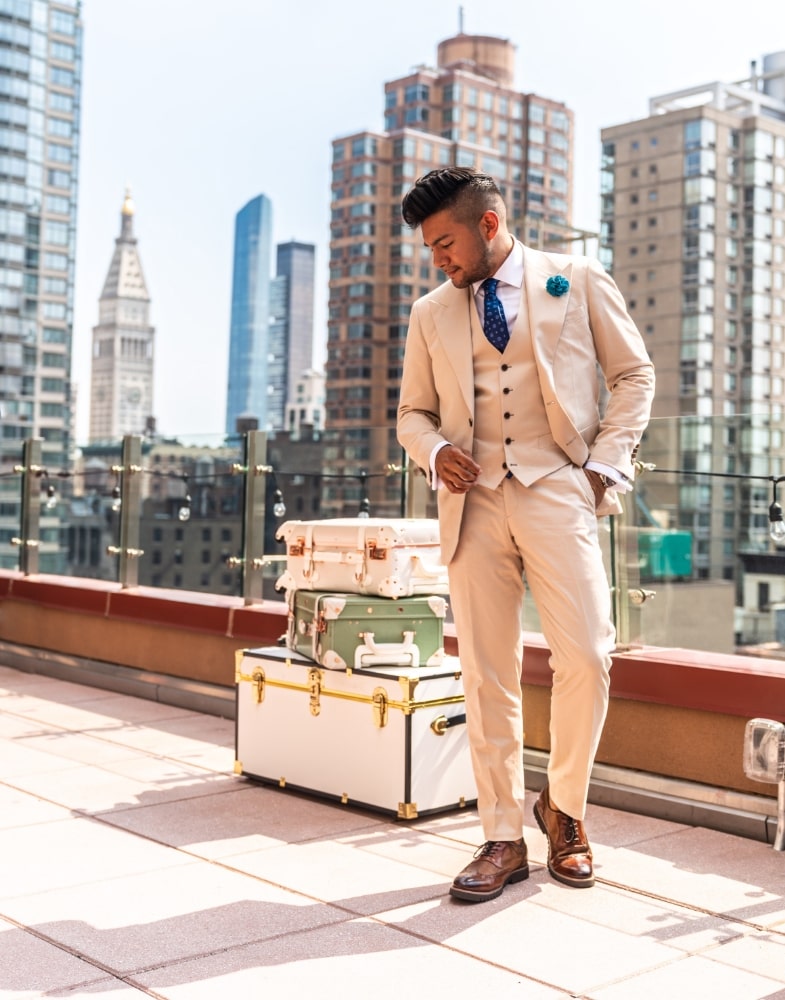 Image of social media influencer Diego Leon wearing the Baxley Wingtip Oxford in Cognac on a rooftop in Manhattan, NY.