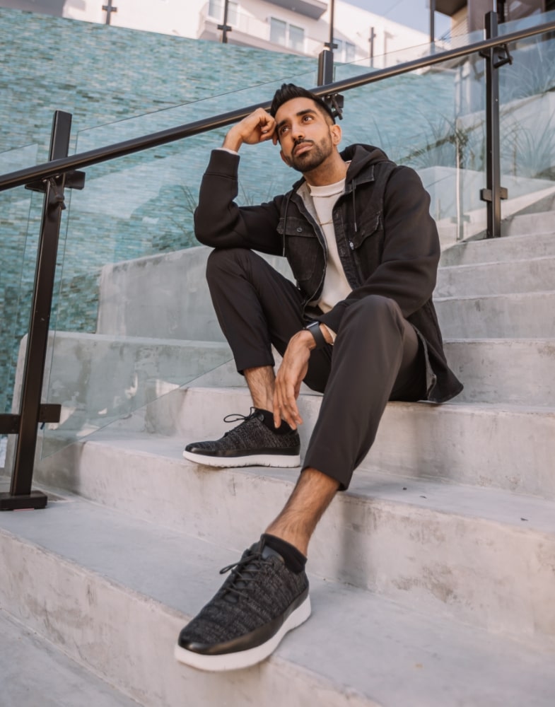 Image of social media influencer Gurneet Mangat sitting on the steps outside while wearing the Hal Moc Toe Lace Up in Black/Gray.