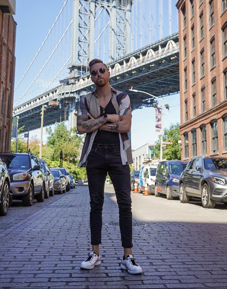 Image of social media influencer Jeremy Moore standing in the street wearing the Halden Cap Toe Elastic Lace Up in White.