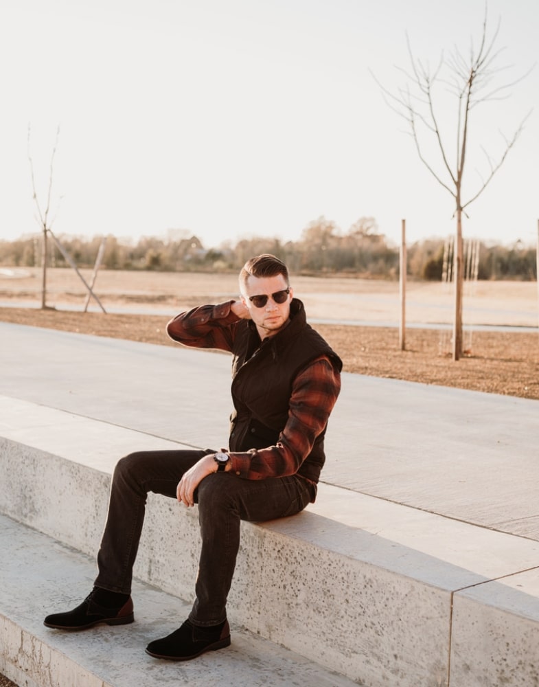 Image of social media influencer Matt Hartman sitting outside in the Kingston Plain Toe Chukka Boot in Black Multi.