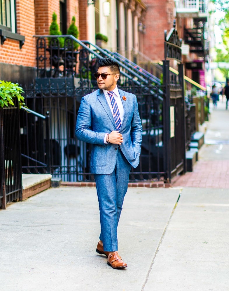 Image of social media influencer Diego Leon wearing the Madison Cap Toe Double Monk Strap in Oak while looking off into the distance.