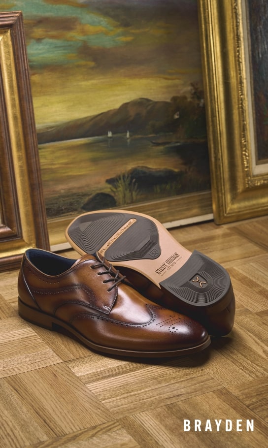 Men's Dress Shoes category. Image features the Brayden wingtip in cognac.