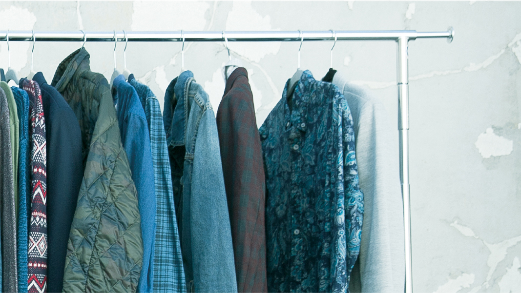 The featured image displays a variety of Stacy Adams clothing pieces on a rack.