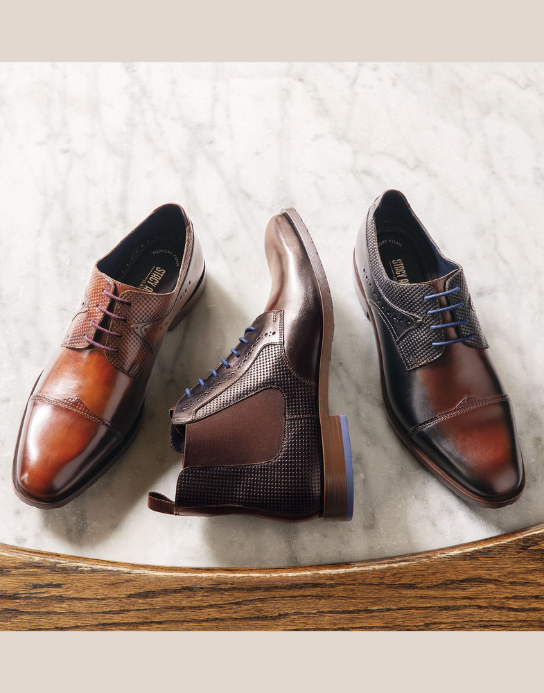 Image of a feature from the September 2018 issue of Sports Illustrated Magazine. The featured products are the Baxley Wingtip Oxford in Ink Blue and Black and the Barcliff Cap Toe Oxford in Cognac.