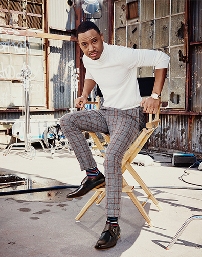 Image of a feature from the November 2015 issue of GQ Magazine. The featured image is a model sitting in a directors chair wearing the Stratford Wingtip Monk Strap in Black.