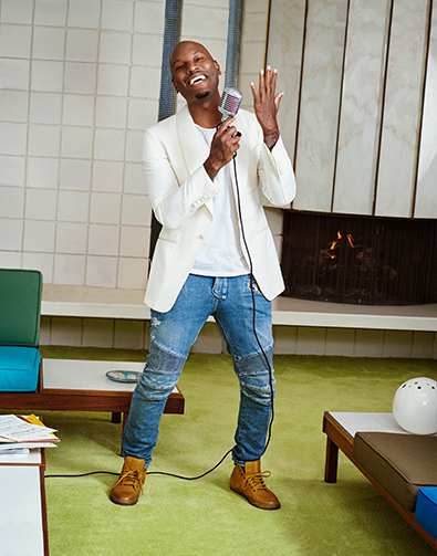 Image of a feature from the October 2016 issue of GQ Magazine. The featured image is Tyreese Gibson singing in the Winchell Moc Toe Boot in Antique Gold.