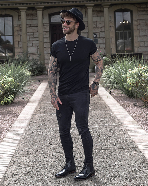 Image of social media influencer Eddy Grim wearing the Rupert Plain Toe Lace and Gore Boot in Black while posing for a picture.