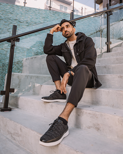 Image of social media influencer Gurneet Mangat sitting on the steps outside while wearing the Hal Moc Toe Lace Up in Black/Gray.