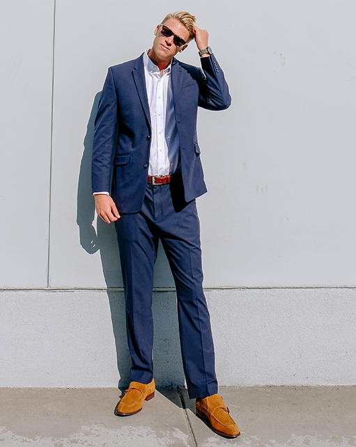 Image of social media influencer Drew Mellon from the duo "Beach Byrds" wearing the Balen Moc Toe Double Monk in Tan and posing for the camera.
